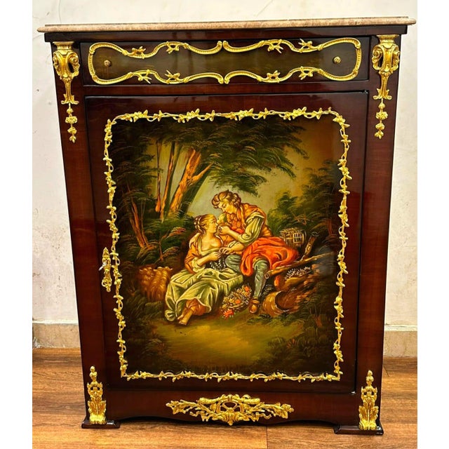 Celebrate the timeless beauty of French artistry with this exceptional Louis XVI-inspired accent cabinet. Expertly...