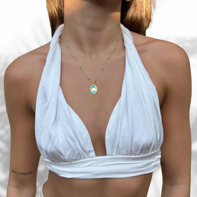 The Powerful & Lucky Elephant Gold & Turquoise Chain Necklace is a testament to the harmonious blend of elegance and...