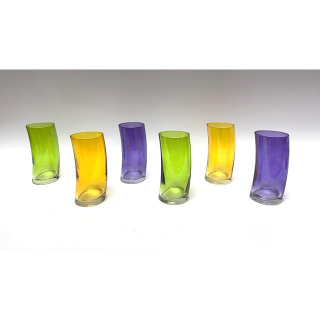 This Set of 6 Colorful Vintage Curved German Highball Glasses features a playful bent silhouette and vibrant hues of...