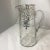 An etched, silver overlay glass set comprising of: a water pitcher, and 6 water glasses. Each are embellished with ridged,...