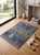 This small hand-knotted Gabbeh rug was woven in Afghanistan by Turkmen weaving families in the pictorial folk style of the...