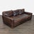 This Restoration Hardware 3-seat sofa features rich brown leather and spacious seating. The sofa has a sturdy frame and...