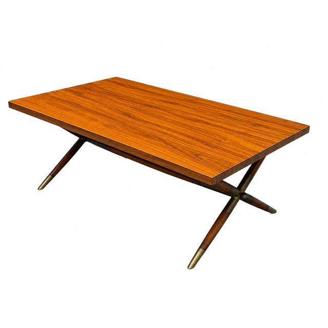 Keno Bros Rectangular Wood Table Rectangular coffee table by Keno Bros. Features a wood grain finish, brass accent legs,...