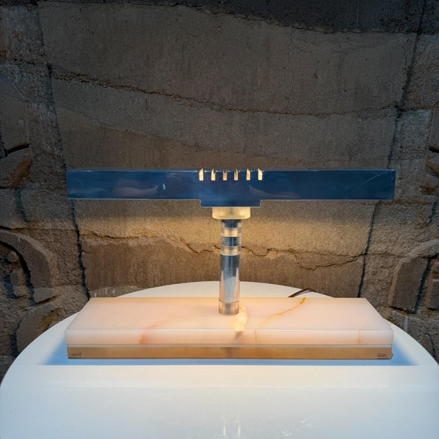 For your consideration, a Mid-Century Modern desk lamp, likely originating from the 1950s or 1970s. It features a...