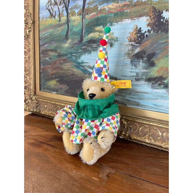 This vintage Steiff clown teddy bear features the brand's signature craftsmanship, made from 50% wool and 50% cotton. The...