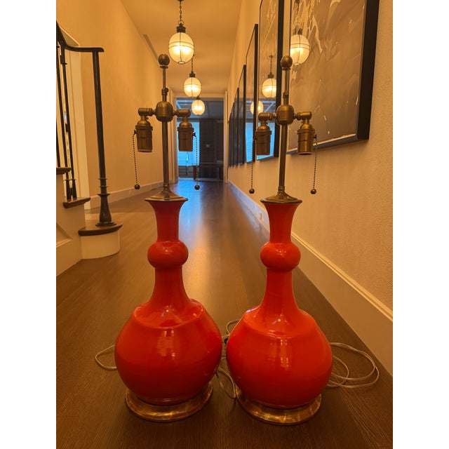 These bright orange-red table lamps will add personality and life into any space. Tall and captivating, the lamps...