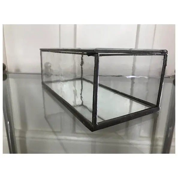 A stunning glass and mirrored curio box from the 1960s, featuring clean, minimal lines that make it a perfect addition to...