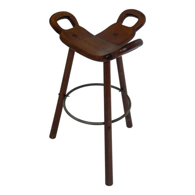 Designed by Sergio Rodrigues for Confonorm, barstool model Marbella. Made from solid wood and a metal base. This piece is...