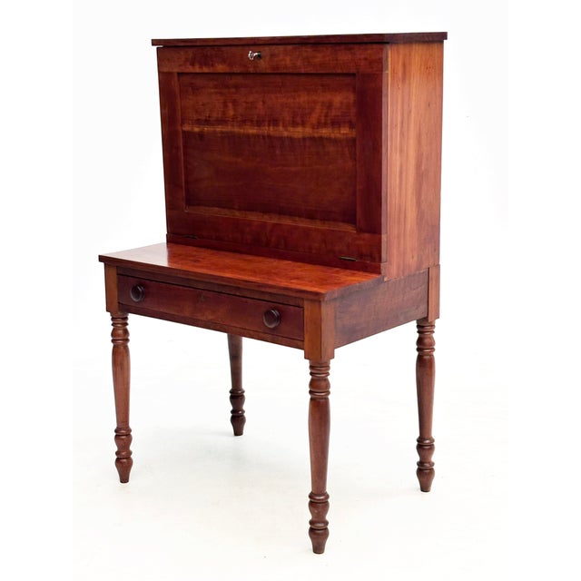 This mid-19th century American cherry plantation desk, also known as a country secretary or fall-front desk, offers a...