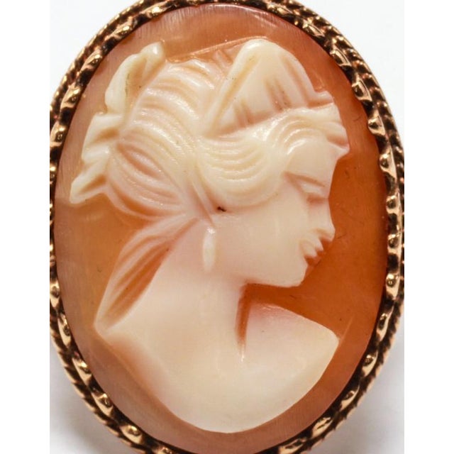 10K yellow gold ring with carved shell cameo depicting woman's profile. Marked: "10K." Ring size 6.5 Approximately: 3.3...