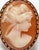 10K yellow gold ring with carved shell cameo depicting woman's profile. Marked: "10K." Ring size 6.5 Approximately: 3.3...