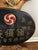 A vintage hand carved Japanese wooden apothecary trade or shop sign finished in black and gold lacquer and a red-and-white...
