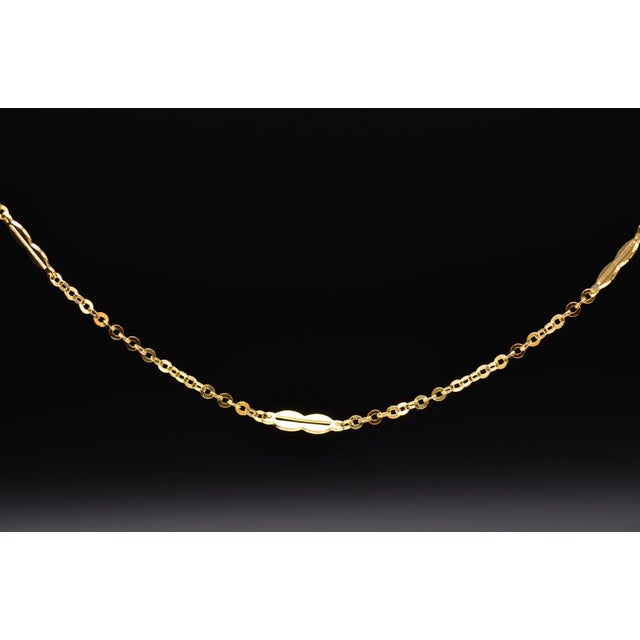 The Pacman: Vintage Yellow Gold Station Chain. This station chain features an interesting double circle with central...