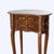 A 20th-century French kidney-shaped stand, crafted from rosewood with intricate marquetry and adorned with ormolu mounts....