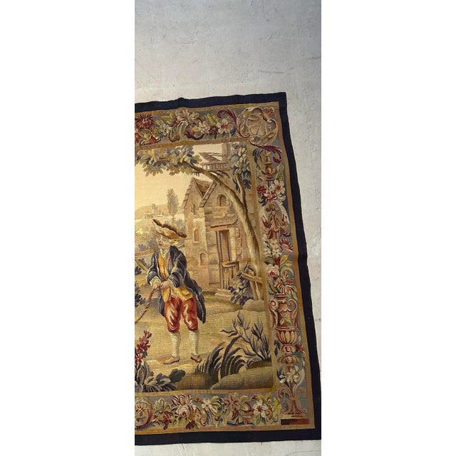 19th Century French Tapestry feature a scen with children playing jumping rope with a landscape background. The figures...