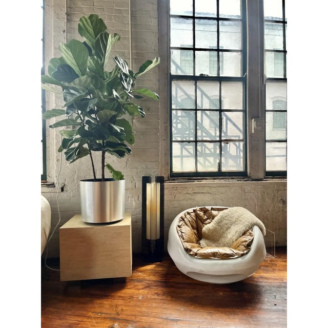 A 1960s Italian Mid-Century Modern pod chair, attributed to Mario Sabot. This sculptural, low-slung chair features a...