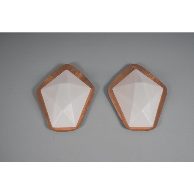 Unique, elegant and highly decorative Anthroposophical Mid Century Modern wall fixtures. Designed and manufactured...