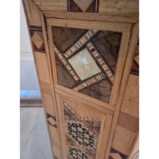 A very fine vintage mid century hand made exotic wood and mother of pearl drink table . Having exquisite and precise...