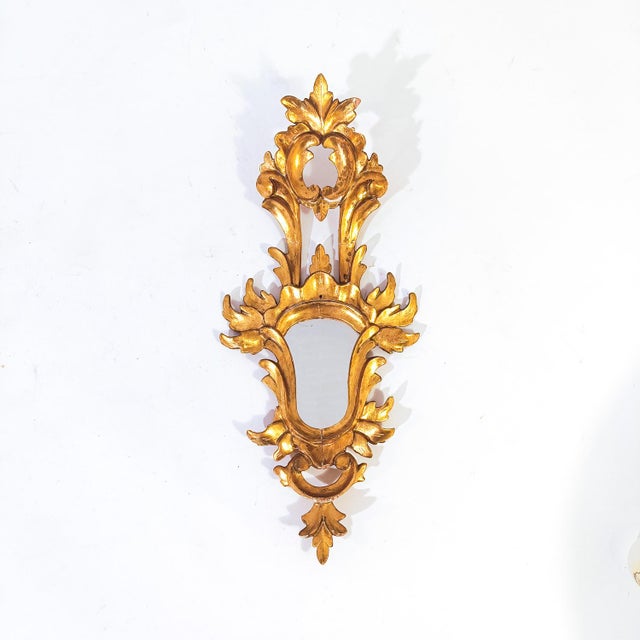 Pair of antique French baroque style mirrors, 1940s. Hand-carved wooden body with plaster and gold leaf finish. This type...