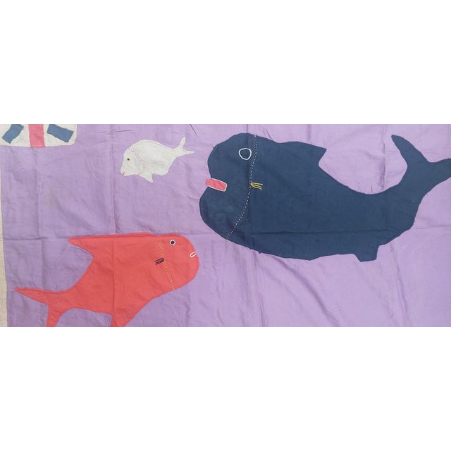 An authentic Fante Asafo flag from Ghana, hand-stitched in bold appliqué and selected for our RareFinds collection. These...