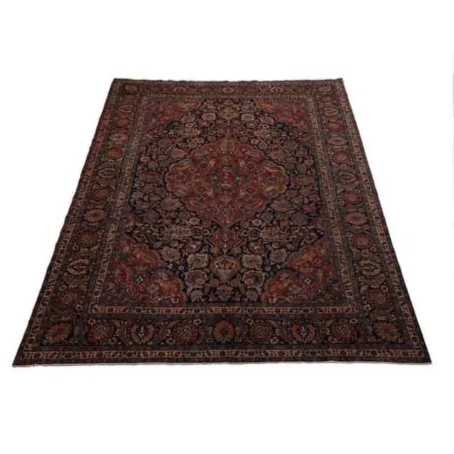 ACTUAL SIZE: 10’10” x 14’4″ PRIMARY COLOR: Navy / Rust AGE: Old MATERIALS: Wool FOUNDATION: Cotton PRODUCTION: Handwoven,...