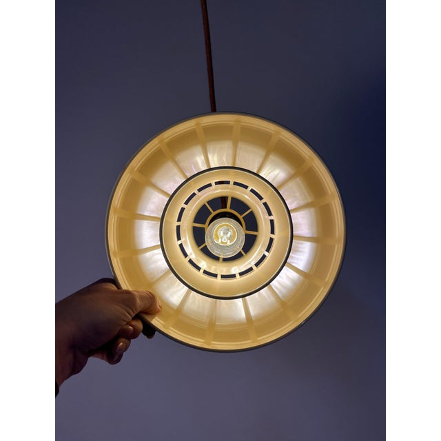The Minisol pendant lamp in a subtle cream tone is a true cult classic of Danish design, created by K. Kewo for Nordisk...