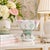 This is a rare and unusual blanc de chine porcelain footed bowl, with a petaloid, scalloped rim, and sculpted lotus, lily...