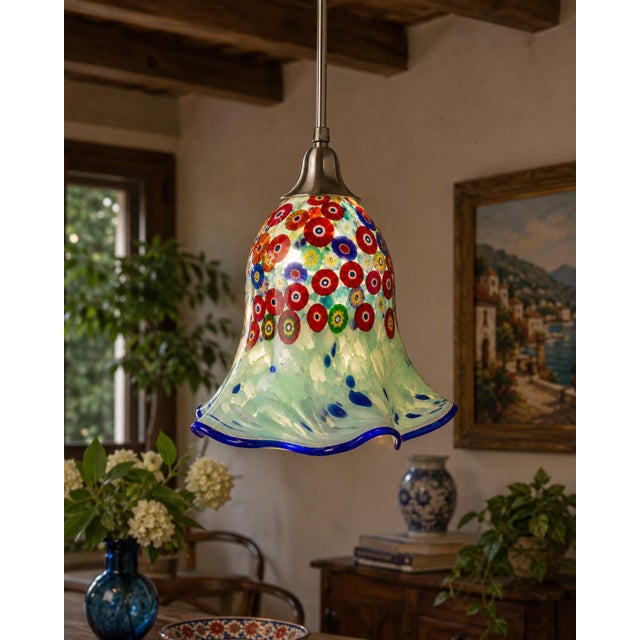 A striking vintage hand-blown art glass lamp shade featuring colorful millefiori-style floral murrines against a luminous...