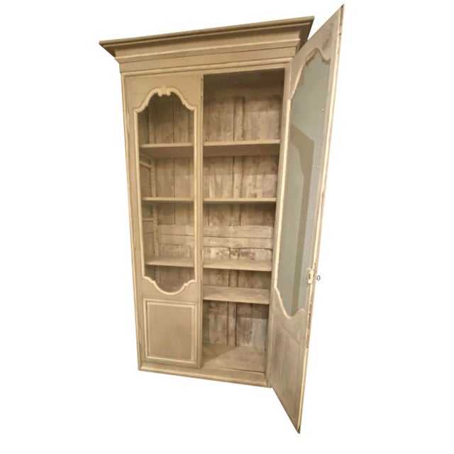 With wire door and original hardware the 18th Century Louis XVI French Cupboard is a fabulous decorators piece and a...