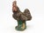 This iconic French Country rooster sculpture, fashioned from aged concrete, exudes rustic elegance and timeless allure....