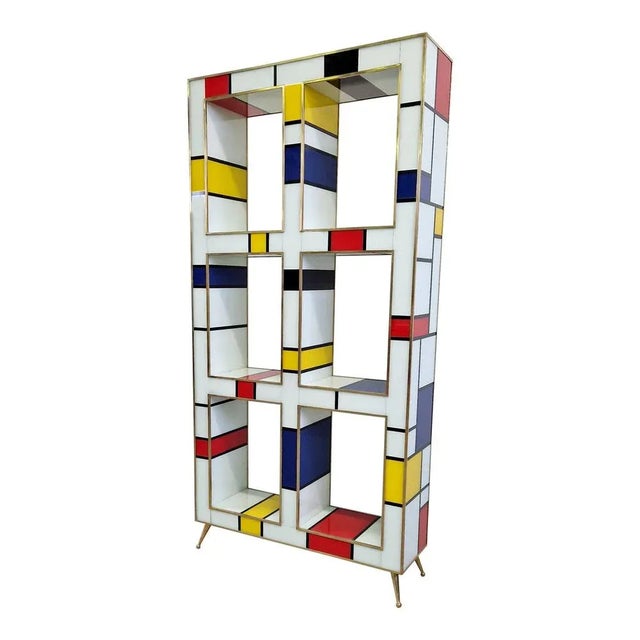 Exposed double-sided bookcase, entirely handmade, with wooden structure covered in multicolored glass (Mondrian style);...