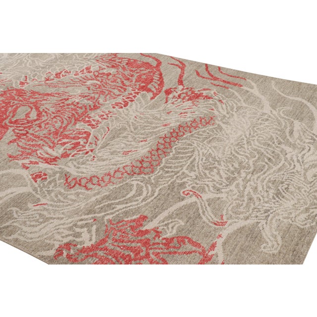 Hand-knotted in wool, this 6x9 modern dragon distressed rug, originating from India is inspired by Oriental dragon rugs...