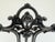 An ornate antique Victorian umbrella and walking stick stand featuring an elaborate cast-iron framework with graceful...