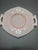 This product is a beautifully hand-painted frosted pink octagon plate from the 1970s, featuring a delicate flower pattern....