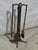 This is a unique and very old hand forged fire place tool set.