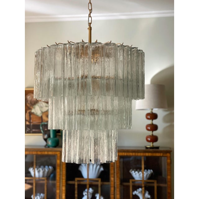 Large scale italian, murano chandelier in traditional italian mid-century style, produced during the 21th century. The...