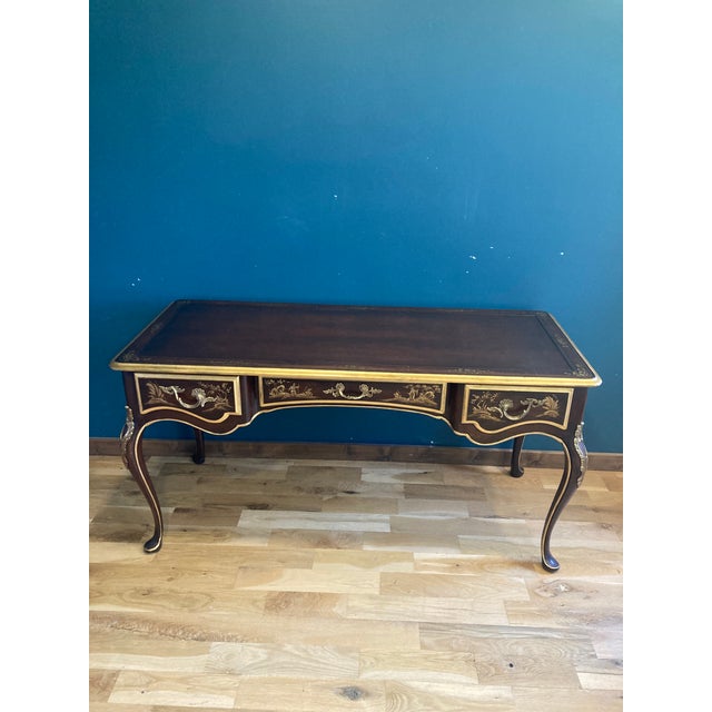 A beautiful Union National Furniture desk and chair set in a Chinoiserie-inspired design. The desk is finished in a rich...