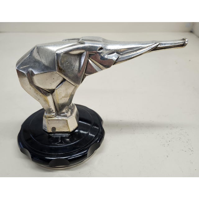 Jacques Cartier Art Deco Hood Ornament on Bakelite radiator cap. Bronze silvered.
