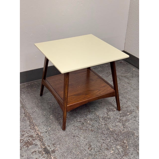 Design Plus Gallery presents the Parker Side Table from Madison Park. This two-tone design pairs an off-white square top...