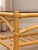 A beautiful Danish bamboo and glass coffee table, circa 1960s, with a warm bamboo frame and smoked glass top. The table...