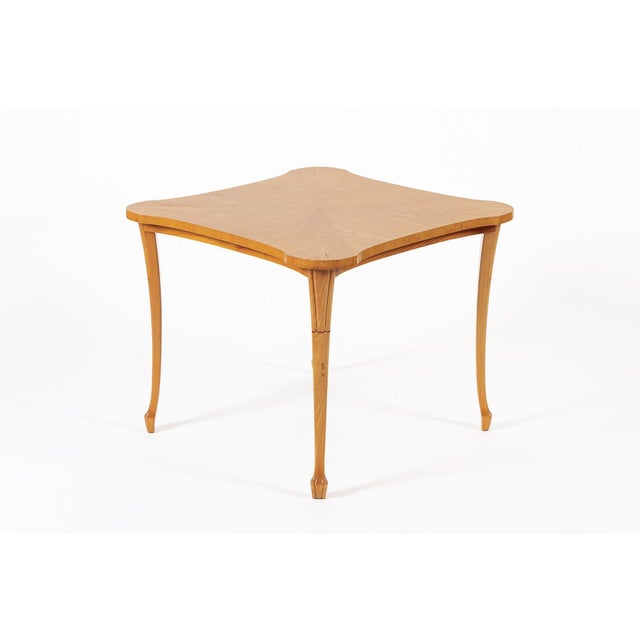 This lovely antique Swedish Art Deco square table is circa 1940. The table is well-crafted from solid beech wood and beech...