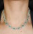 A remarkable platinum necklace combining modern elegance with timeless sophistication. This exquisite piece features 23...