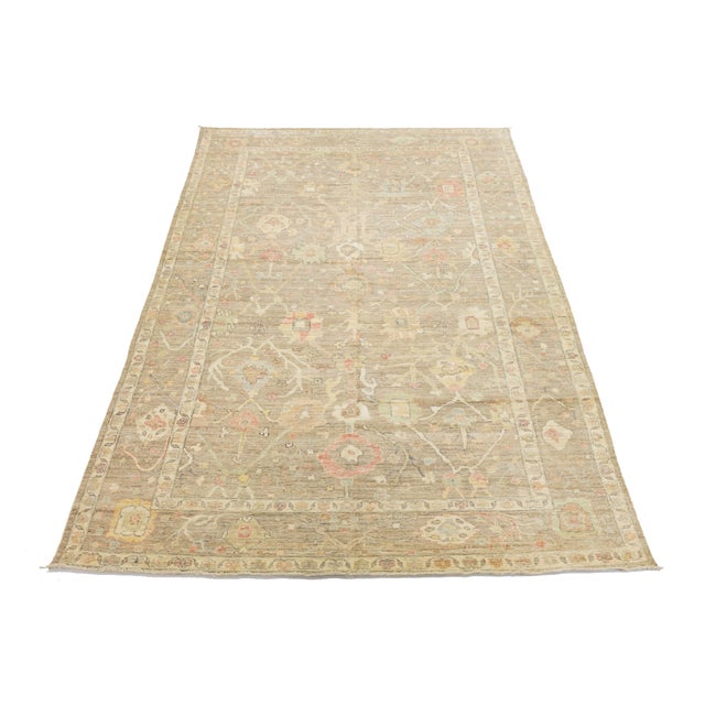 Enhance your space with this sophisticated Oushak-style wool rug, featuring a low-pile texture and a refined neutral...