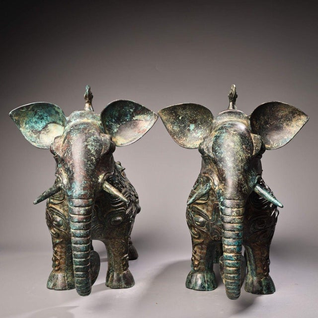 This striking pair of bronze vessels is modeled in the form of standing elephants, drawing inspiration from archaic ritual...