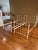 Pair of traditional brass and iron antique twin beds. Beds are painted white with decorative castings on the head and foot...