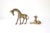 These little guys are really cute. It is a small vintage brass baby giraffe and mom. Perfect for tucking into you shelf...