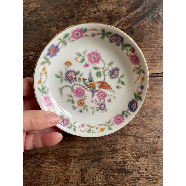 Set of 11 French porcelain small berry bowls, presented in a bird of paradise pattern that is vibrant and colorful. Around...