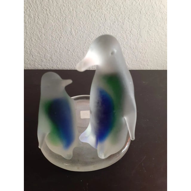 It is Satin Glass Penguins Candle Holder. Multicolor & satin glass gives it beauty. Great decor piece. Procured at antique...