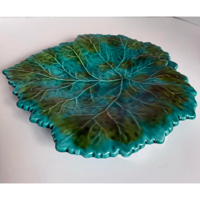 This vintage majolica leaf plate was likely produced in Portugal, circa the 1960s, and features a beautifully molded...