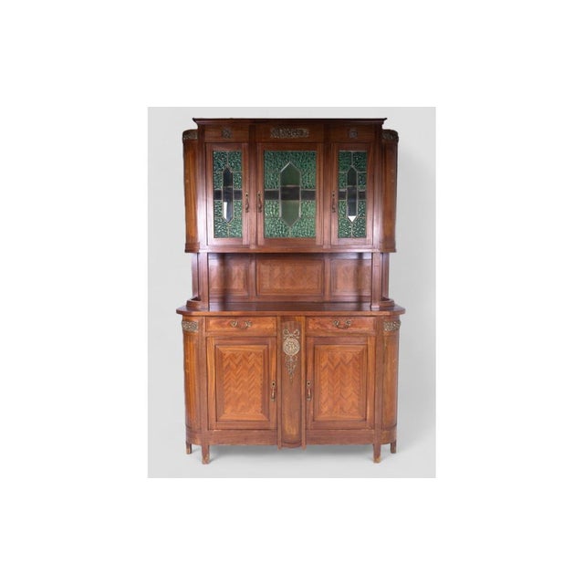This charming vintage sideboard, dating back to the early 20th century, is an elegant example of past craftsmanship. The...